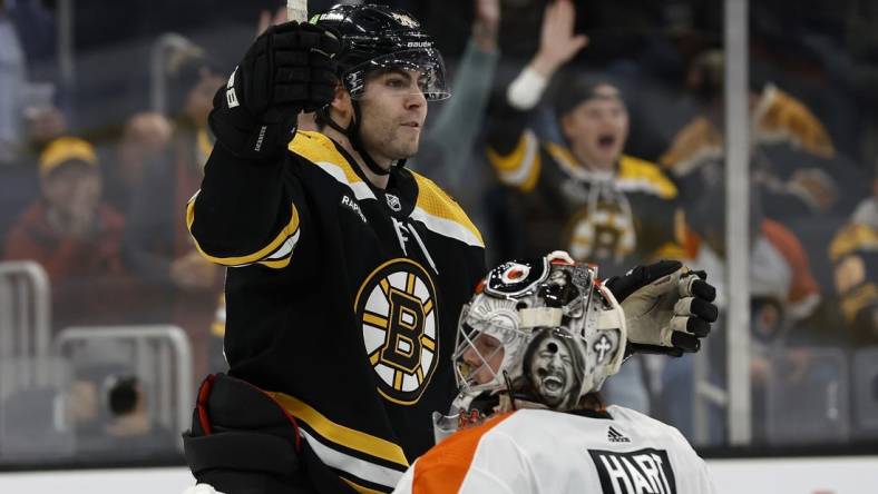 Nov 17, 2022; Boston, Massachusetts, USA; Boston Bruins left wing Jake DeBrusk (74) celebrates his goal on Philadelphia Flyers goaltender Carter Hart (79) during the third period at TD Garden. Mandatory Credit: Winslow Townson-USA TODAY Sports