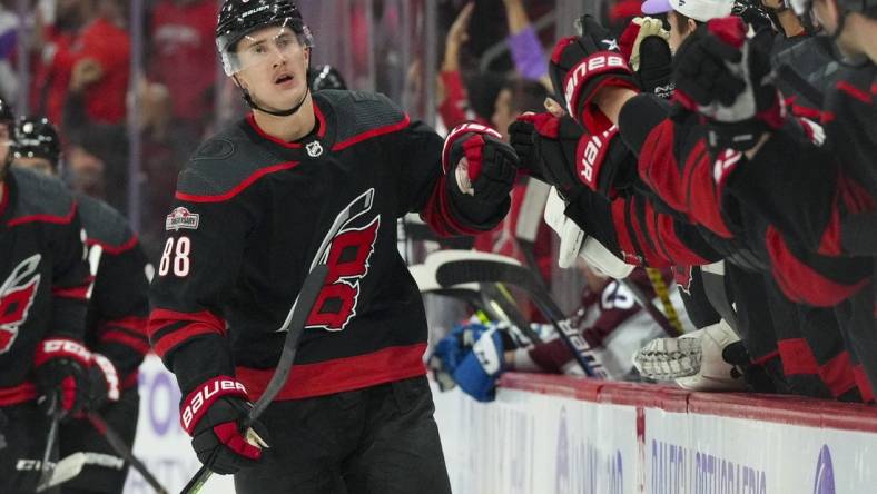 Nov 17, 2022; Raleigh, North Carolina, USA; Carolina Hurricanes center Martin Necas (88) celebrates his goal against the Colorado Avalanche during the third period at PNC Arena. Mandatory Credit: James Guillory-USA TODAY Sports