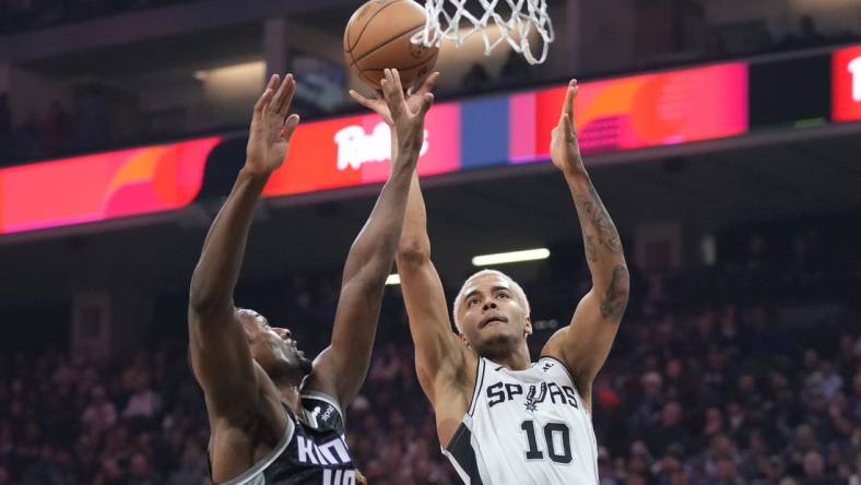 November 17, 2022; Sacramento, California, USA;  San Antonio Spurs forward Jeremy Sochan (10) shoots the basketball against Sacramento Kings forward Harrison Barnes (40) during the first quarter at Golden 1 Center. Mandatory Credit: Kyle Terada-USA TODAY Sports