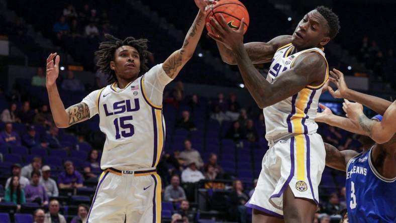 Nov 17, 2022; Baton Rouge, Louisiana, USA; LSU Tigers forward Tyrell Ward (15) goes for rebound against New Orleans Privateers forward D'Ante Bell (3) during the second half at Pete Maravich Assembly Center. Mandatory Credit: Stephen Lew-USA TODAY Sports