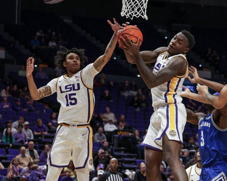 Nov 17, 2022; Baton Rouge, Louisiana, USA; LSU Tigers forward Tyrell Ward (15) goes for rebound against New Orleans Privateers forward D'Ante Bell (3) during the second half at Pete Maravich Assembly Center. Mandatory Credit: Stephen Lew-USA TODAY Sports