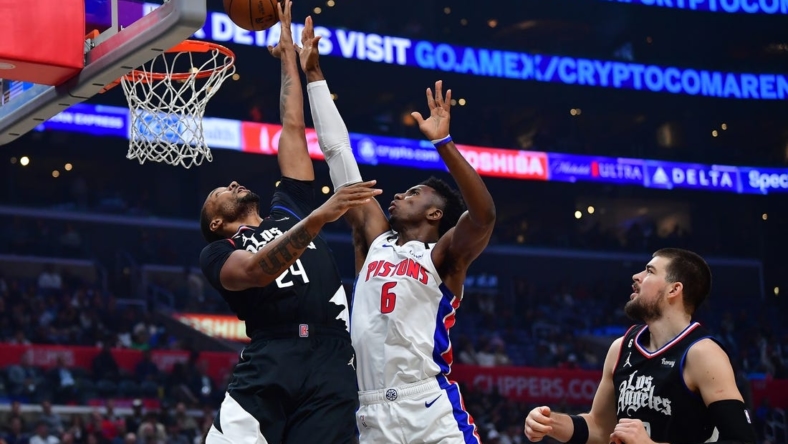 Nov 17, 2022; Los Angeles, California, USA;Los Angeles Clippers forward Norman Powell (24) shoots against Detroit Pistons guard Hamidou Diallo (6)  during the first half at Crypto.com Arena. Mandatory Credit: Gary A. Vasquez-USA TODAY Sports