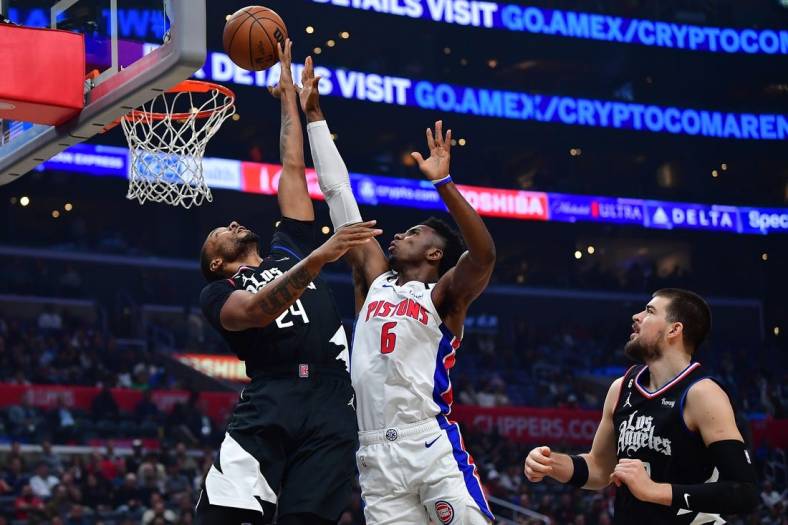Nov 17, 2022; Los Angeles, California, USA;Los Angeles Clippers forward Norman Powell (24) shoots against Detroit Pistons guard Hamidou Diallo (6)  during the first half at Crypto.com Arena. Mandatory Credit: Gary A. Vasquez-USA TODAY Sports