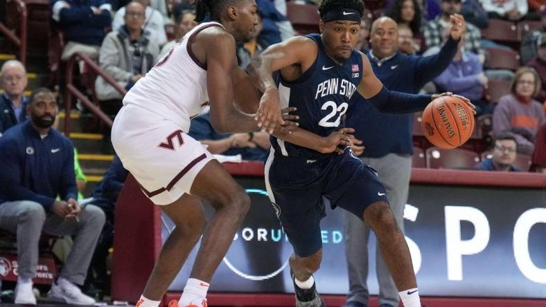 Nov 18, 2022; Charleston, South Carolina, USA; Penn State Nittany Lions guard Jalen Pickett (22) drives against Virginia Tech Hokies forward Justyn Mutts (25) in the second half at TD Arena. Mandatory Credit: David Yeazell-USA TODAY Sports