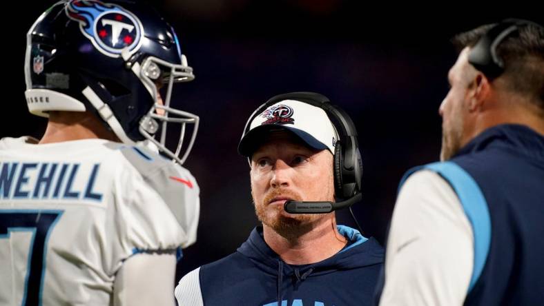 Tennessee Titans offensive coordinator Todd Downing talks to quarterback Ryan Tannehill (17) and head coach Mike Vrabel during the second quarter against the Buffalo Bills at Highmark Stadium Monday, Sept. 19, 2022, in Orchard Park, New York.

Nfl Tennessee Titans At Buffalo Bills