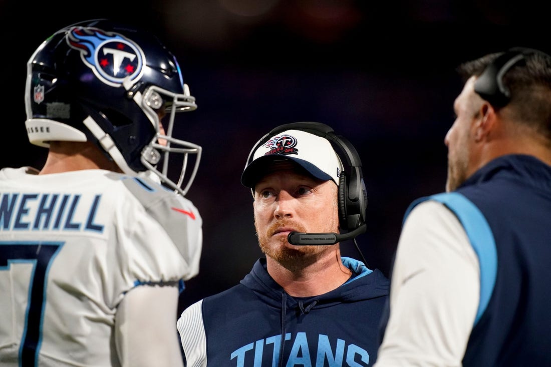Tennessee Titans offensive coordinator Todd Downing talks to quarterback Ryan Tannehill (17) and head coach Mike Vrabel during the second quarter against the Buffalo Bills at Highmark Stadium Monday, Sept. 19, 2022, in Orchard Park, New York.

Nfl Tennessee Titans At Buffalo Bills