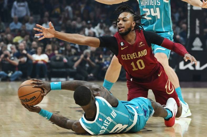 Nov 18, 2022; Cleveland, Ohio, USA; Cleveland Cavaliers guard Darius Garland (10) goes for the ball as Charlotte Hornets guard Terry Rozier (3) tries to pass from the floor during the first quarter at Rocket Mortgage FieldHouse. Mandatory Credit: Ken Blaze-USA TODAY Sports