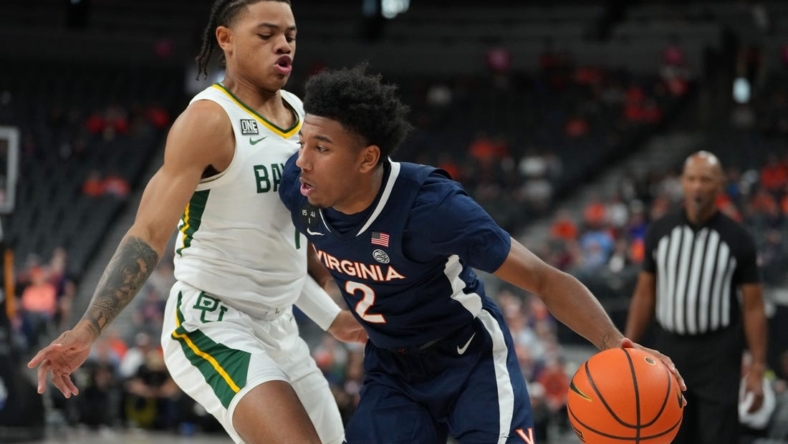 Nov 18, 2022; Las Vegas, Nevada, USA; Virginia Cavaliers guard Reece Beekman (2) dribbles against Baylor Bears guard Keyonte George (1) during the first half at T-Mobile Arena. Mandatory Credit: Stephen R. Sylvanie-USA TODAY Sports