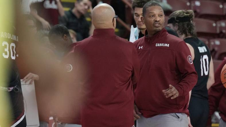 Nov 18, 2022; Charleston, South Carolina, USA; South Carolina Gamecocks head coach Lamont Paris talks with his staff in the second half against the Davidson Wildcats at TD Arena. Mandatory Credit: David Yeazell-USA TODAY Sports