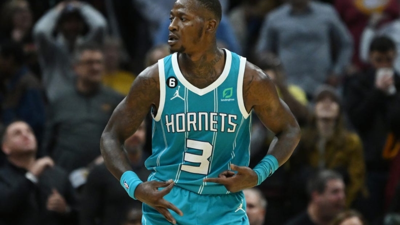 Nov 18, 2022; Cleveland, Ohio, USA; Charlotte Hornets guard Terry Rozier (3) celebrates after hitting a three point shot during overtime against the Cleveland Cavaliers at Rocket Mortgage FieldHouse. Mandatory Credit: Ken Blaze-USA TODAY Sports