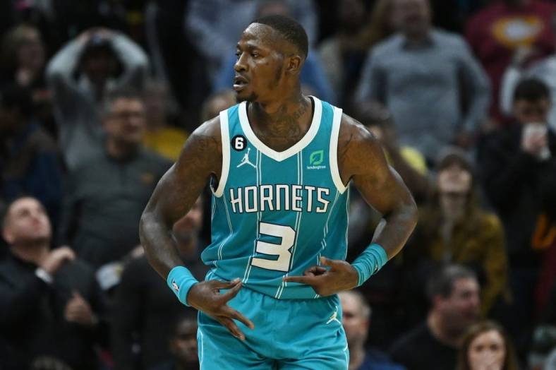 Nov 18, 2022; Cleveland, Ohio, USA; Charlotte Hornets guard Terry Rozier (3) celebrates after hitting a three point shot during overtime against the Cleveland Cavaliers at Rocket Mortgage FieldHouse. Mandatory Credit: Ken Blaze-USA TODAY Sports