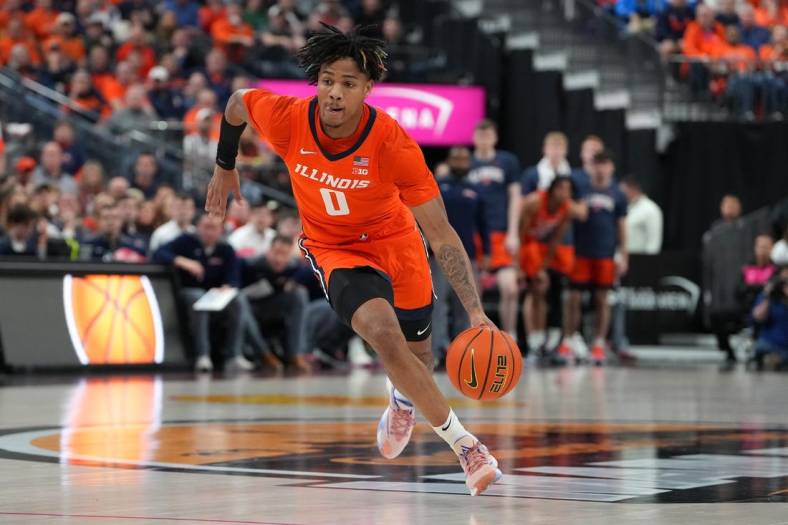 Nov 18, 2022; Las Vegas, Nevada, USA; Illinois Fighting Illini guard Terrence Shannon Jr. (0) dribbles against the UCLA Bruins during the first half at T-Mobile Arena. Mandatory Credit: Stephen R. Sylvanie-USA TODAY Sports