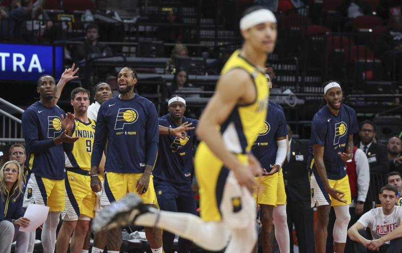 Nov 18, 2022; Houston, Texas, USA; Indiana Pacers players react after guard Andrew Nembhard (2) scores during the fourth quarter against the Houston Rockets at Toyota Center. Mandatory Credit: Troy Taormina-USA TODAY Sports
