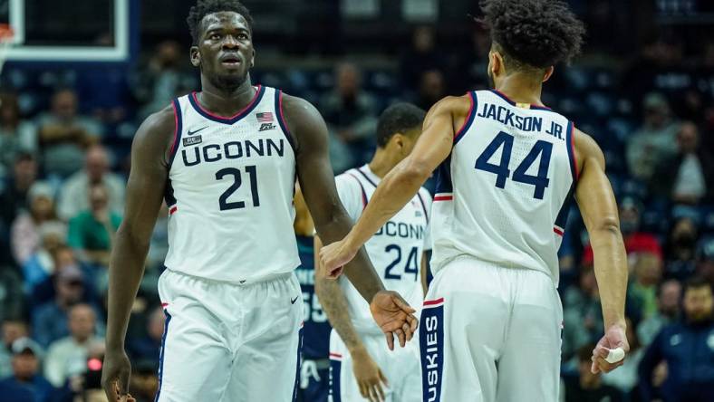 Nov 18, 2022; Storrs, Connecticut, USA; Connecticut Huskies forward Adama Sanogo (21) and guard Andre Jackson Jr. (44) react after a play against the North Carolina-Wilmington Seahawks in the second half at Harry A. Gampel Pavilion. Mandatory Credit: David Butler II-USA TODAY Sports