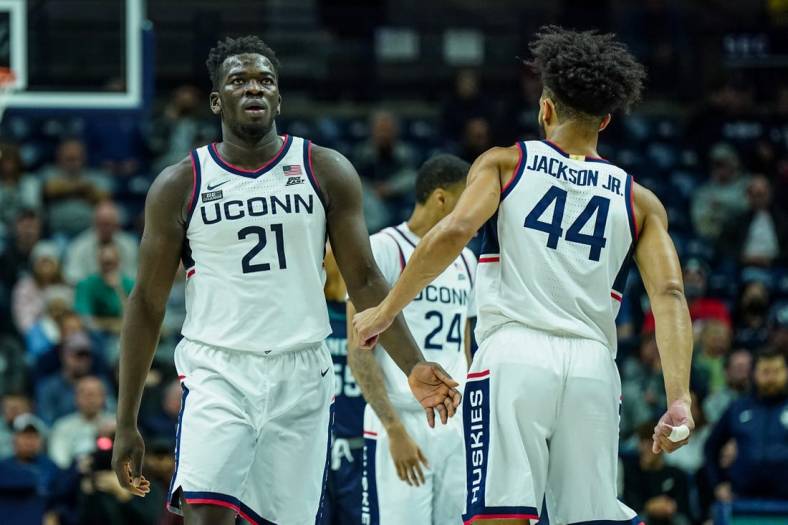 Nov 18, 2022; Storrs, Connecticut, USA; Connecticut Huskies forward Adama Sanogo (21) and guard Andre Jackson Jr. (44) react after a play against the North Carolina-Wilmington Seahawks in the second half at Harry A. Gampel Pavilion. Mandatory Credit: David Butler II-USA TODAY Sports