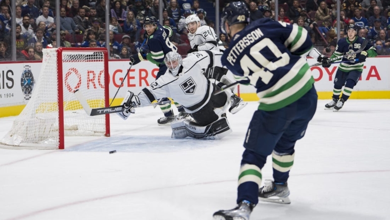 Nov 18, 2022; Vancouver, British Columbia, CAN; Vancouver Canucks forward Elias Pettersson (40) scores his second goal of the game on Los Angeles Kings goalie Jonathan Quick (32) in the second period at Rogers Arena. Mandatory Credit: Bob Frid-USA TODAY Sports