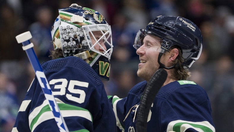 Nov 18, 2022; Vancouver, British Columbia, CAN; Vancouver Canucks goalie Thatcher Demko (35) and forward Brock Boeser (6) celebrate their victory against the Los Angeles Kings at Rogers Arena. Canucks won 4-1. Mandatory Credit: Bob Frid-USA TODAY Sports