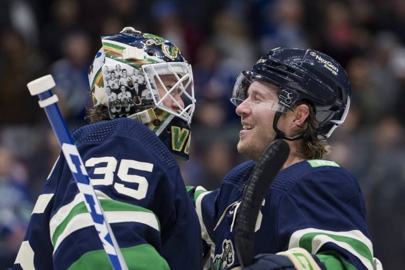 Nov 18, 2022; Vancouver, British Columbia, CAN; Vancouver Canucks goalie Thatcher Demko (35) and forward Brock Boeser (6) celebrate their victory against the Los Angeles Kings at Rogers Arena. Canucks won 4-1. Mandatory Credit: Bob Frid-USA TODAY Sports