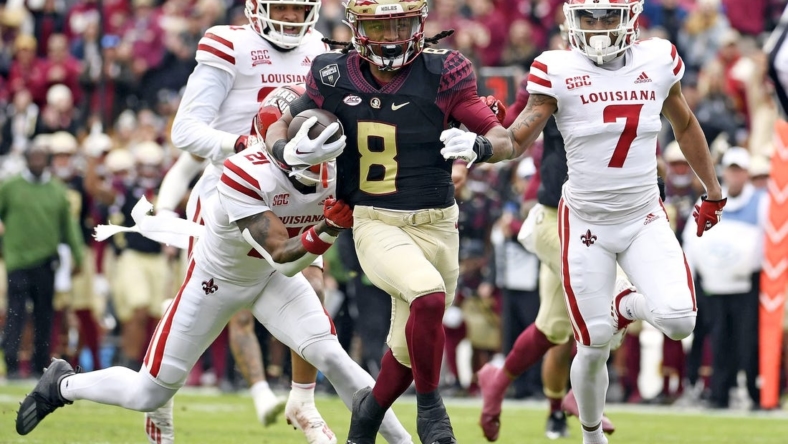Nov 19, 2022; Tallahassee, Florida, USA; Florida State Seminoles running back Treshaun Ward (8) runs the ball for a touchdown during the first half of the game against the Louisiana Ragin' Cajuns at Doak S. Campbell Stadium. Mandatory Credit: Melina Myers-USA TODAY Sports