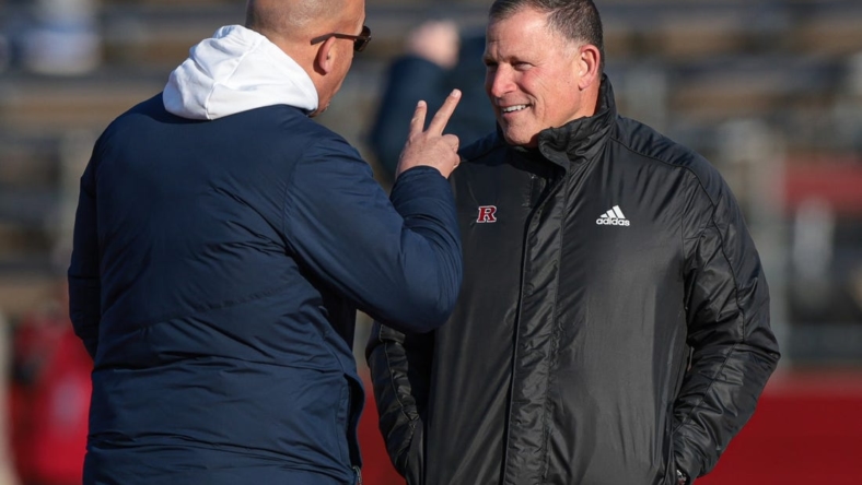 Nov 19, 2022; Piscataway, New Jersey, USA; Penn State Nittany Lions head coach James Franklin (left) talks with Rutgers Scarlet Knights head coach Greg Schiano before the game at SHI Stadium. Mandatory Credit: Vincent Carchietta-USA TODAY Sports