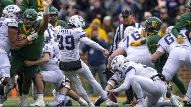 Nov 19, 2022; Waco, Texas, USA; TCU Horned Frogs place kicker Griffin Kell (39) kicks the game winning field goal against the Baylor Bears as time expires in the game at McLane Stadium. Mandatory Credit: Jerome Miron-USA TODAY Sports