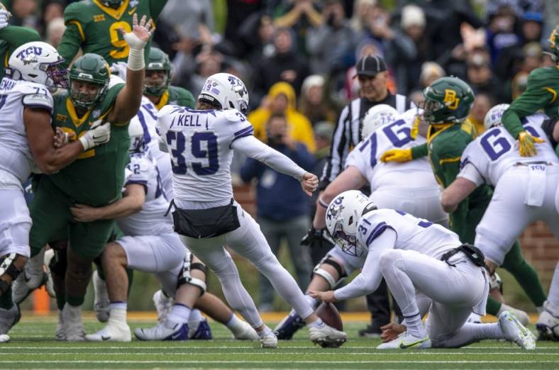 Nov 19, 2022; Waco, Texas, USA; TCU Horned Frogs place kicker Griffin Kell (39) kicks the game winning field goal against the Baylor Bears as time expires in the game at McLane Stadium. Mandatory Credit: Jerome Miron-USA TODAY Sports