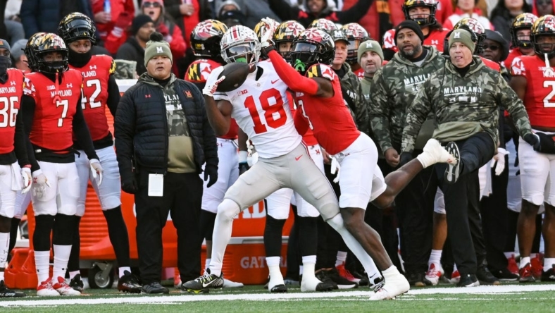 Nov 19, 2022; College Park, Maryland, USA;  Ohio State Buckeyes wide receiver Marvin Harrison Jr. (18) catches a pass as Maryland Terrapins defensive back Deonte Banks (3) defends during the first quarter at SECU Stadium. Mandatory Credit: Tommy Gilligan-USA TODAY Sports