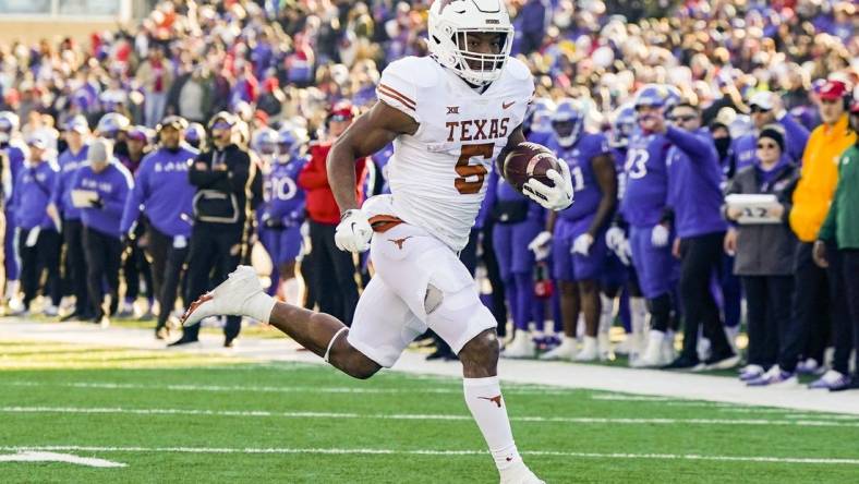 Nov 19, 2022; Lawrence, Kansas, USA; Texas Longhorns running back Bijan Robinson (5) runs for a touchdown during the first half against the Kansas Jayhawks at David Booth Kansas Memorial Stadium. Mandatory Credit: Jay Biggerstaff-USA TODAY Sports