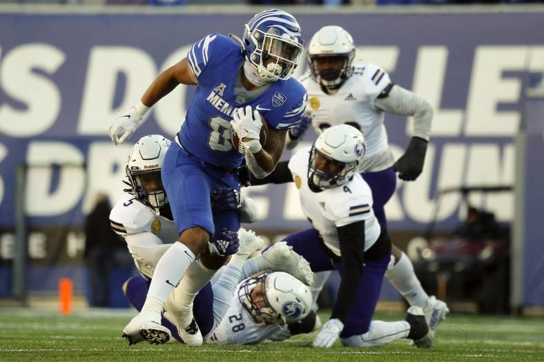 Nov 19, 2022; Memphis, Tennessee, USA; Memphis Tigers running back Jevyon Ducker (8) runs the ball during the second half against the North Alabama Lions at Simmons Bank Liberty Stadium. Mandatory Credit: Petre Thomas-USA TODAY Sports