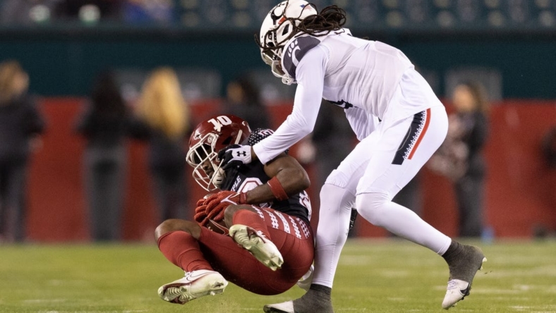 Nov 19, 2022; Philadelphia, Pennsylvania, USA; Temple Owls wide receiver Jose Barbon (10) is tackled by Cincinnati Bearcats cornerback Arquon Bush (9) after a catch during the second quarter at Lincoln Financial Field. Mandatory Credit: Bill Streicher-USA TODAY Sports