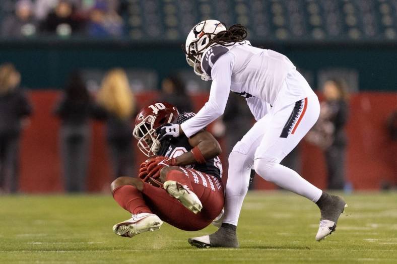 Nov 19, 2022; Philadelphia, Pennsylvania, USA; Temple Owls wide receiver Jose Barbon (10) is tackled by Cincinnati Bearcats cornerback Arquon Bush (9) after a catch during the second quarter at Lincoln Financial Field. Mandatory Credit: Bill Streicher-USA TODAY Sports
