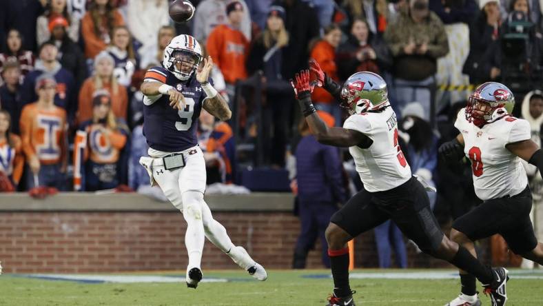 Nov 19, 2022; Auburn, Alabama, USA; Auburn Tigers quarterback Robby Ashford (9) shows a pass during the second quarter against the Western Kentucky Hilltoppers at Jordan-Hare Stadium. Mandatory Credit: John Reed-USA TODAY Sports