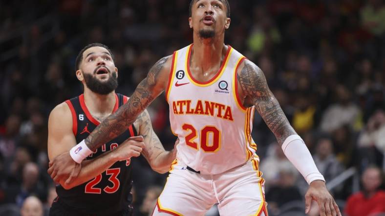 Nov 19, 2022; Atlanta, Georgia, USA; Atlanta Hawks forward John Collins (20) boxes out Toronto Raptors guard Fred VanVleet (23) in the second quarter at State Farm Arena. Mandatory Credit: Brett Davis-USA TODAY Sports