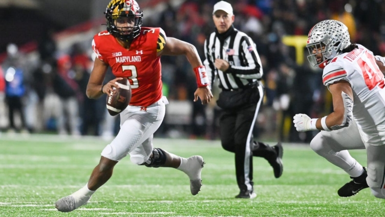 Nov 19, 2022; College Park, Maryland, USA; Maryland Terrapins quarterback Taulia Tagovailoa (3) run by Ohio State Buckeyes defensive end J.T. Tuimoloau (44) during the second half  at SECU Stadium. Mandatory Credit: Tommy Gilligan-USA TODAY Sports