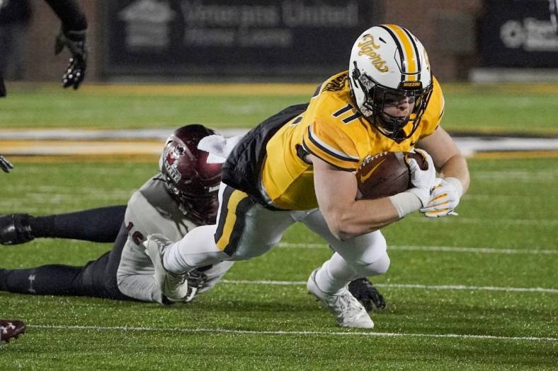 Nov 19, 2022; Columbia, Missouri, USA; Missouri Tigers wide receiver Barrett Banister (11) runs the ball against New Mexico State Aggies defensive lineman Donavan King (16) during the first half at Faurot Field at Memorial Stadium. Mandatory Credit: Denny Medley-USA TODAY Sports