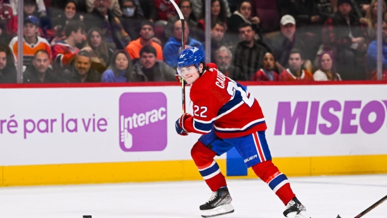 Nov 19, 2022; Montreal, Quebec, CAN; Montreal Canadiens right wing Cole Caufield (22) gets ready to shoot the puck during the second period at Bell Centre. Mandatory Credit: David Kirouac-USA TODAY Sports
