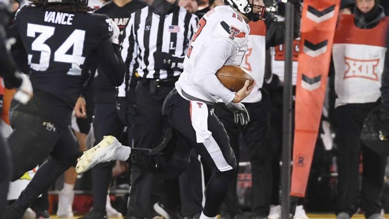 Nov. 19, 2022; Ames, Iowa, USA;  [CAPTION] Texas Tech Red Raiders quarterback Tyler Shough (12) runs with the ball for a first down around Iowa State Cyclones linebacker O'Rien Vance (34) during the second quarter in the senior day Big-12 showdown at Jack Trice Stadium. Mandatory Credit: Nirmalendu Majumdar/Ames Tribune-USA TODAY Network

Ncaa Football Texas Tech At Iowa State