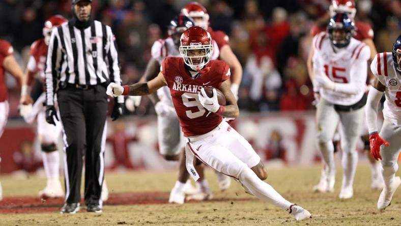 Nov 19, 2022; Fayetteville, Arkansas, USA; Arkansas Razorbacks wide receiver Jadon Haselwood (9) runs after a catch in the second quarter against the Ole Miss Rebels at Donald W. Reynolds Razorback Stadium. Mandatory Credit: Nelson Chenault-USA TODAY Sports