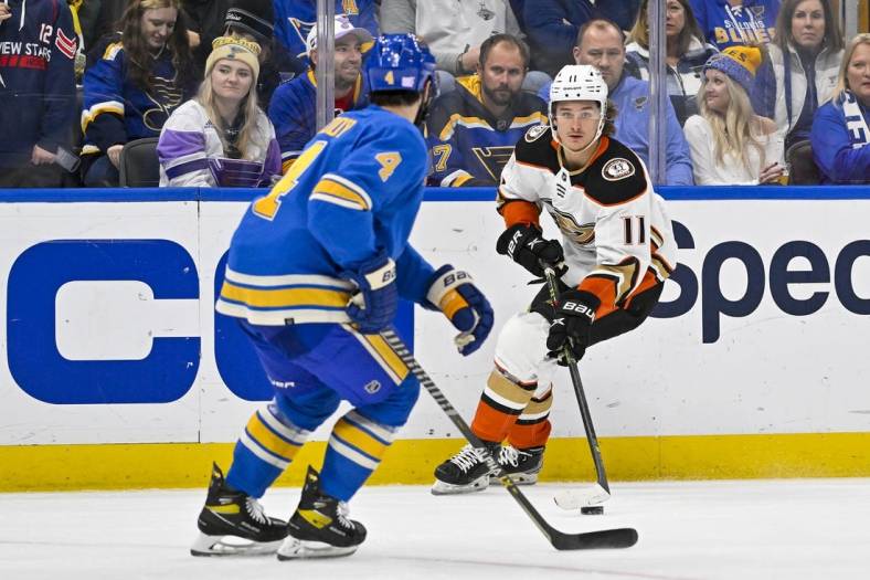 Nov 19, 2022; St. Louis, Missouri, USA;  Anaheim Ducks center Trevor Zegras (11) controls the puck against the St. Louis Blues during the third period at Enterprise Center. Mandatory Credit: Jeff Curry-USA TODAY Sports