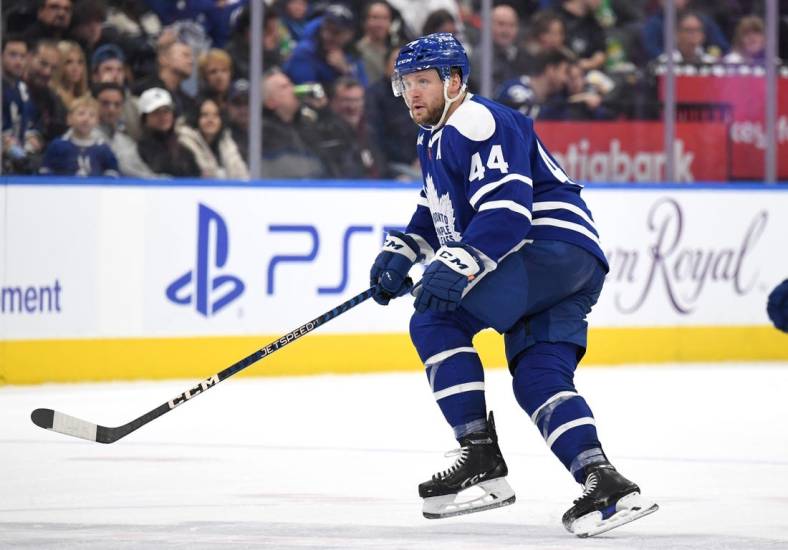Nov 19, 2022; Toronto, Ontario, CAN;  Toronto Maple Leafs defenseman Morgan Rielly (44) defends his zone against the Buffalo Sabres in the third period at Scotiabank Arena. Mandatory Credit: Dan Hamilton-USA TODAY Sports