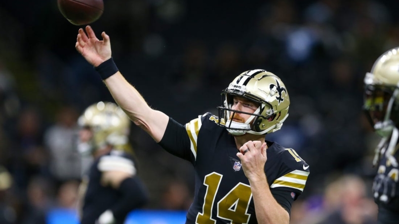 Nov 20, 2022; New Orleans, Louisiana, USA; New Orleans Saints quarterback Andy Dalton (14) warms up before the game against the Los Angeles Rams at the Caesars Superdome. Mandatory Credit: Chuck Cook-USA TODAY Sports