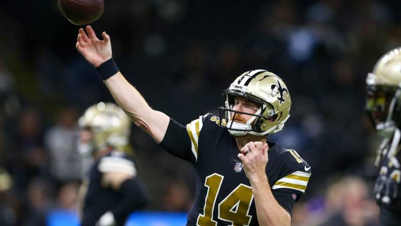 Nov 20, 2022; New Orleans, Louisiana, USA; New Orleans Saints quarterback Andy Dalton (14) warms up before the game against the Los Angeles Rams at the Caesars Superdome. Mandatory Credit: Chuck Cook-USA TODAY Sports