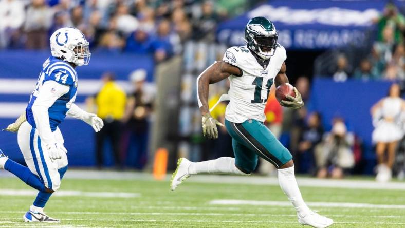 Nov 20, 2022; Indianapolis, Indiana, USA; Philadelphia Eagles wide receiver A.J. Brown (11) runs with the ball while Indianapolis Colts linebacker Zaire Franklin (44) defends in the first quarter at Lucas Oil Stadium. Mandatory Credit: Trevor Ruszkowski-USA TODAY Sports