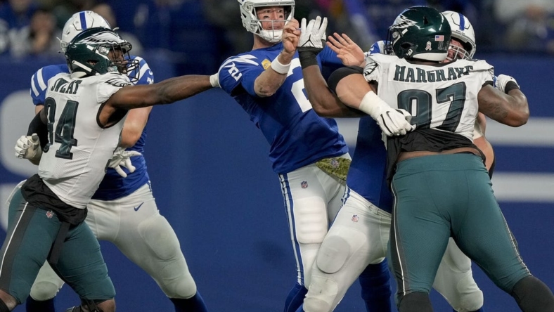 Nov 20, 2022; Indianapolis, Indiana, USA; Indianapolis Colts quarterback Matt Ryan (2) fires off a pass as Philadelphia Eagles defensive end Josh Sweat (94) and Philadelphia Eagles defensive tackle Javon Hargrave (97) move in Sunday, Nov. 20, 2022, during a game against the Philadelphia Eagles at Lucas Oil Stadium in Indianapolis. Mandatory Credit: Robert Scheer-USA TODAY Sports
