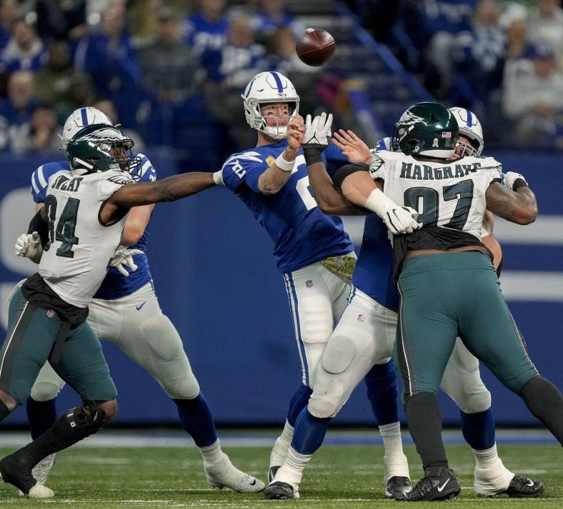 Nov 20, 2022; Indianapolis, Indiana, USA; Indianapolis Colts quarterback Matt Ryan (2) fires off a pass as Philadelphia Eagles defensive end Josh Sweat (94) and Philadelphia Eagles defensive tackle Javon Hargrave (97) move in Sunday, Nov. 20, 2022, during a game against the Philadelphia Eagles at Lucas Oil Stadium in Indianapolis. Mandatory Credit: Robert Scheer-USA TODAY Sports