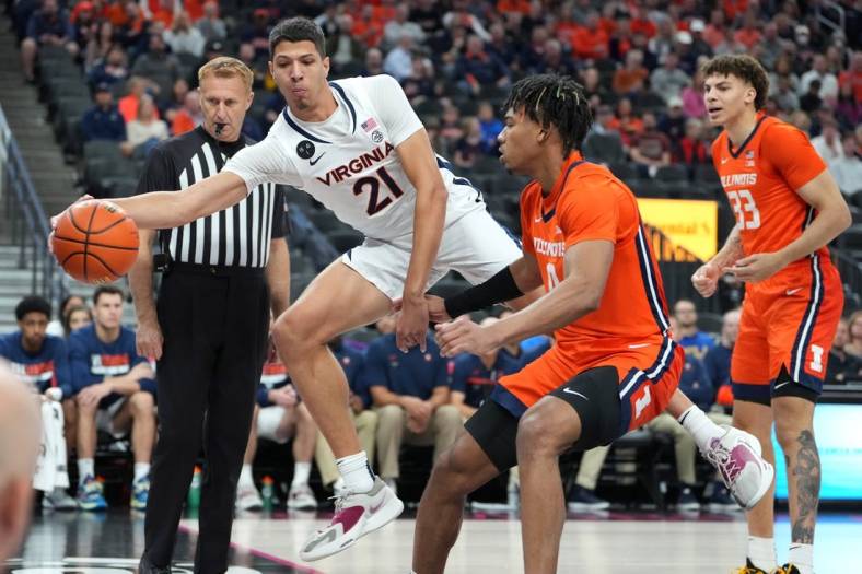 Nov 20, 2022; Las Vegas, Nevada, USA; Virginia Cavaliers forward Kadin Shedrick (21) attempts to keep a ball in play against the Illinois Fighting Illini during the first half at T-Mobile Arena. Mandatory Credit: Stephen R. Sylvanie-USA TODAY Sports