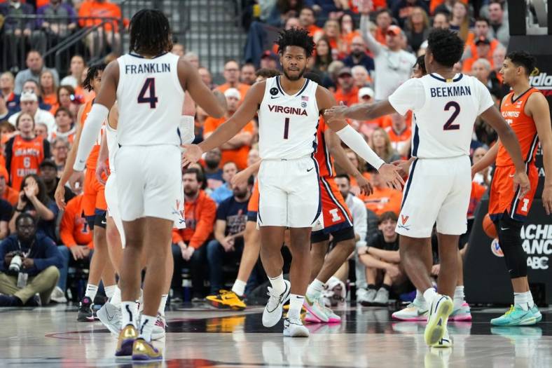 Nov 20, 2022; Las Vegas, Nevada, USA; Virginia Cavaliers forward Jayden Gardner (1) celebrates with Virginia Cavaliers guard Armaan Franklin (4) and Virginia Cavaliers guard Reece Beekman (2) after making a play against the Illinois Fighting Illini during the first half at T-Mobile Arena. Mandatory Credit: Stephen R. Sylvanie-USA TODAY Sports