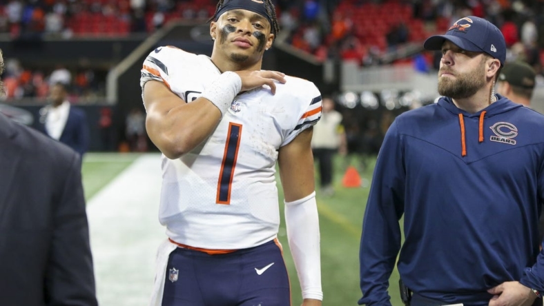 Nov 20, 2022; Atlanta, Georgia, USA; Chicago Bears quarterback Justin Fields (1) walks off the field with medical personnel after a game against the Atlanta Falcons at Mercedes-Benz Stadium. Mandatory Credit: Brett Davis-USA TODAY Sports