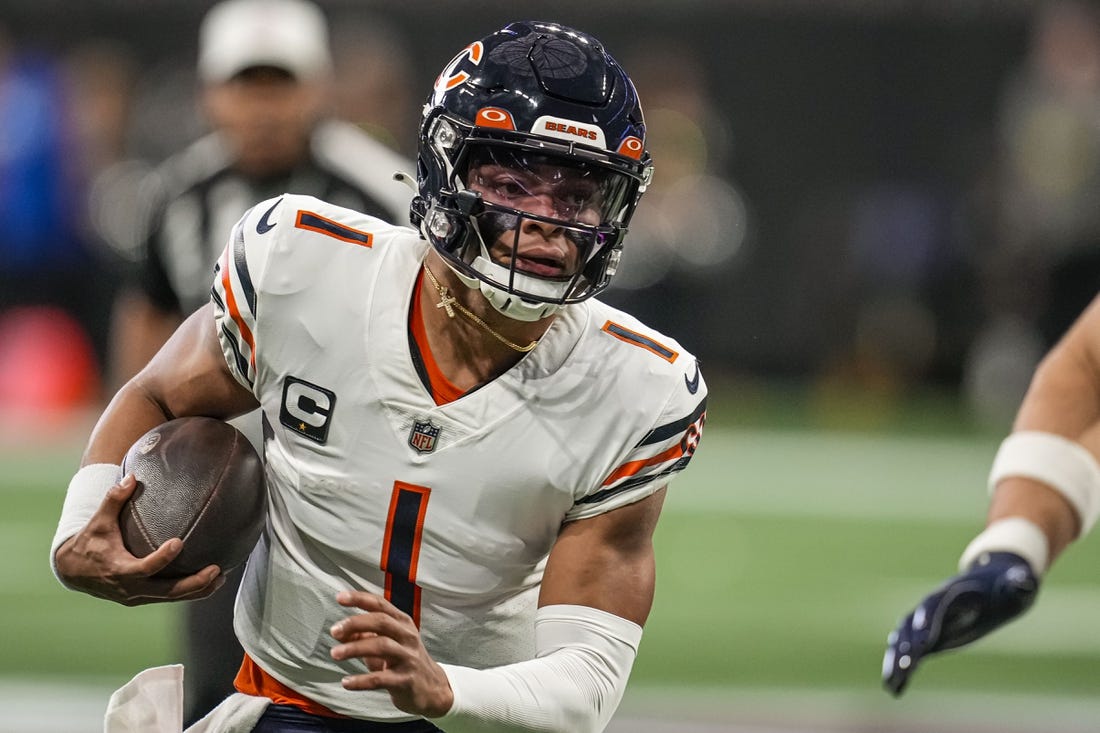 Nov 20, 2022; Atlanta, Georgia, USA; Chicago Bears quarterback Justin Fields (1) runs with the ball against the Atlanta Falcons at Mercedes-Benz Stadium. Mandatory Credit: Dale Zanine-USA TODAY Sports