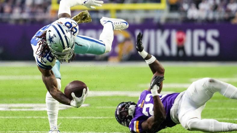 Nov 20, 2022; Minneapolis, Minnesota, USA; Dallas Cowboys wide receiver CeeDee Lamb (88) carries the ball during the first quarter against the Minnesota Vikings at U.S. Bank Stadium. Mandatory Credit: Brace Hemmelgarn-USA TODAY Sports